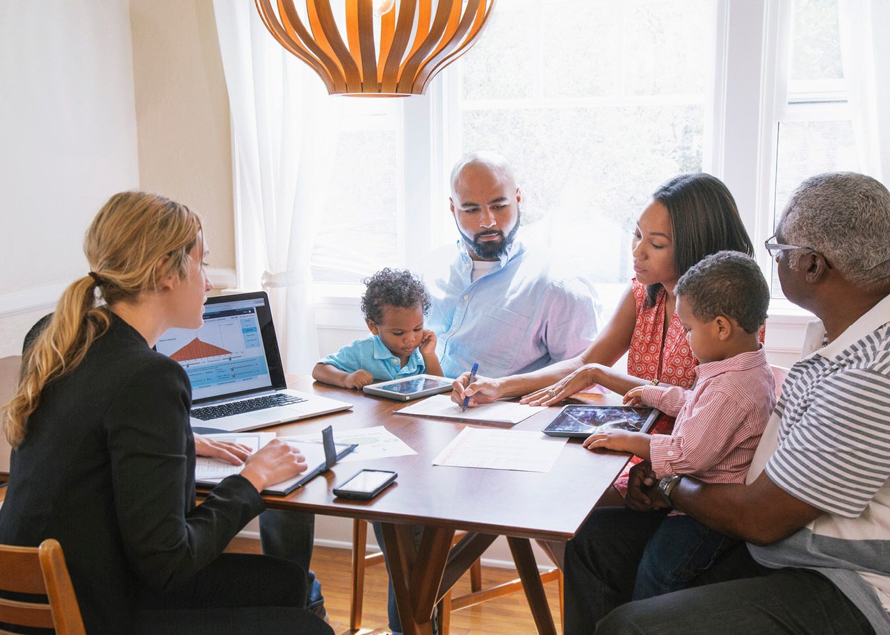 Female advisor with client and their family