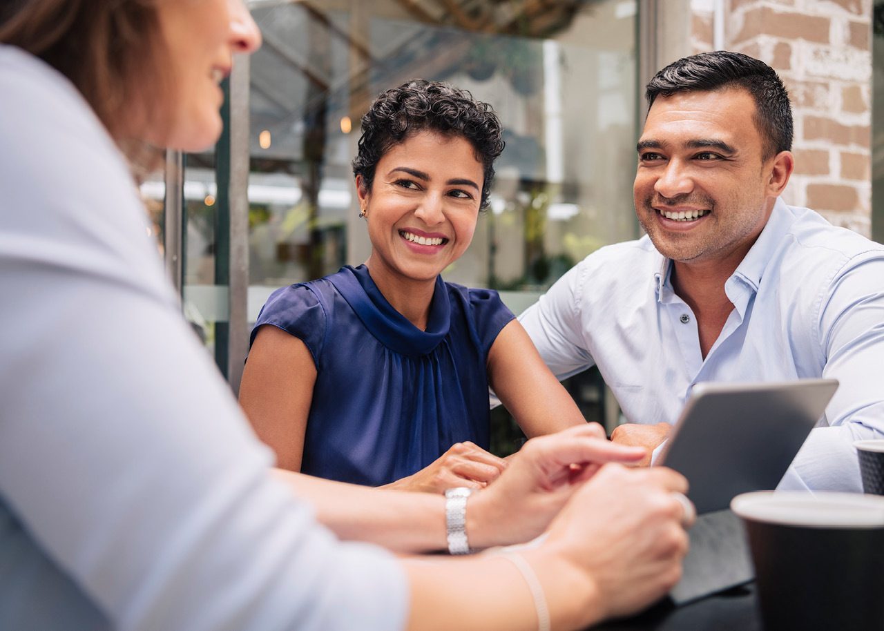 Female advisor meeting with husband and wife clients